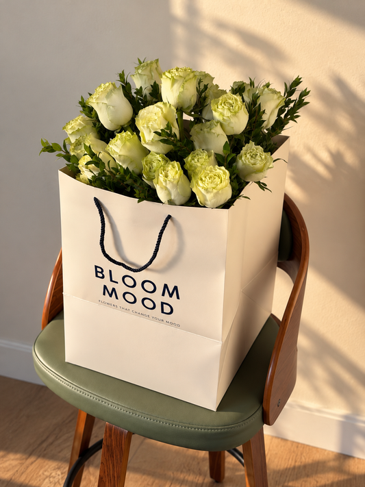 Soft green garden-style roses with layered ivory-green petals and fresh greenery, arranged as an elegant floral bouquet by Bloommood Los Angeles.